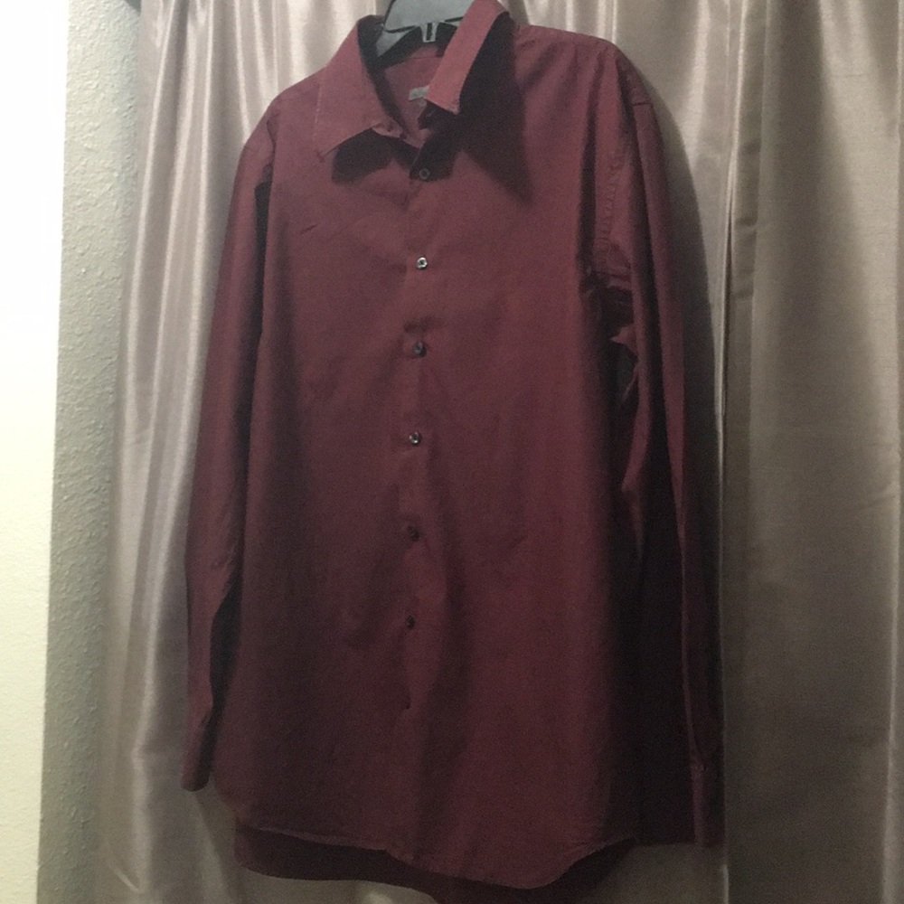 A men’s burgundy button-up dress shirt.